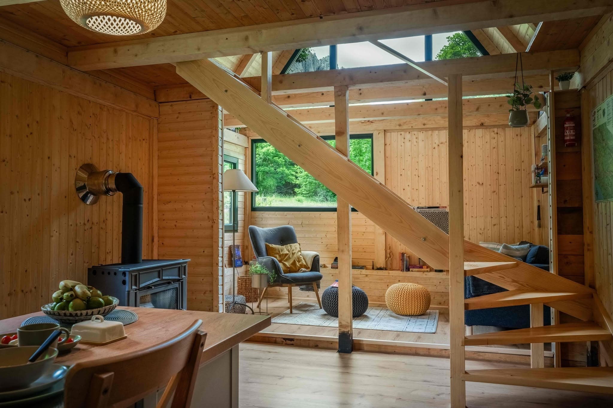 Living room with fireplace and wooden stairs